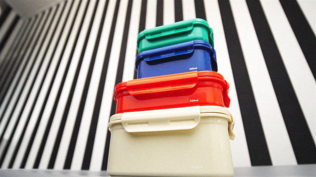 Ivory, red, blue and green KEEPER TEN boxes stacked