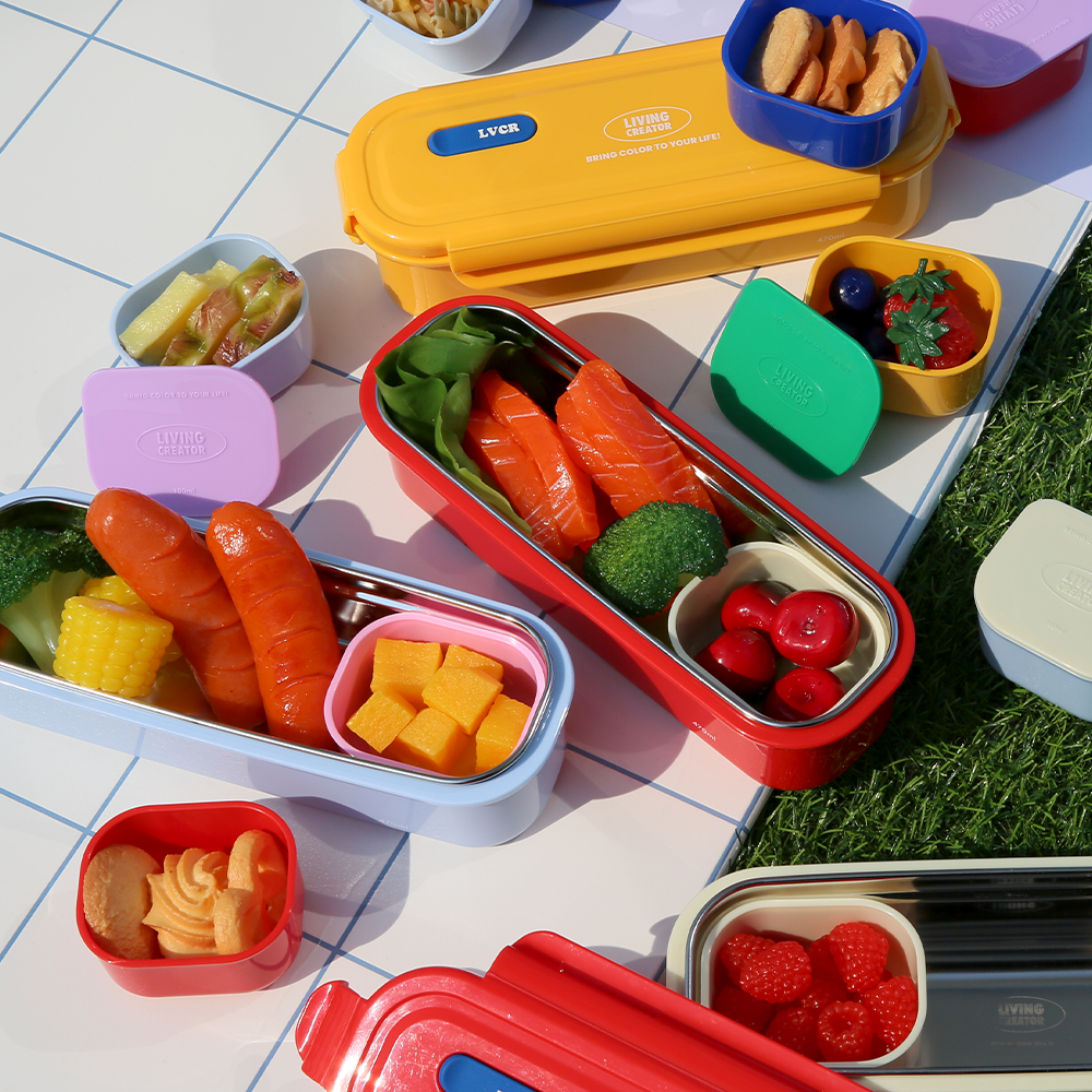 KEEPER LONG at a picnic with side dishes and mini sauce containers