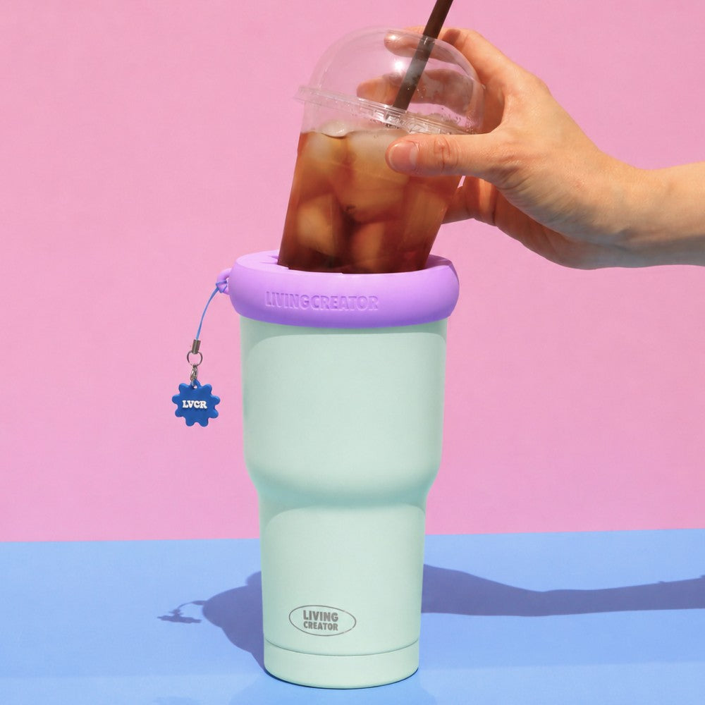 Dropping a take-out iced coffee into a KEEPER TUM holder
