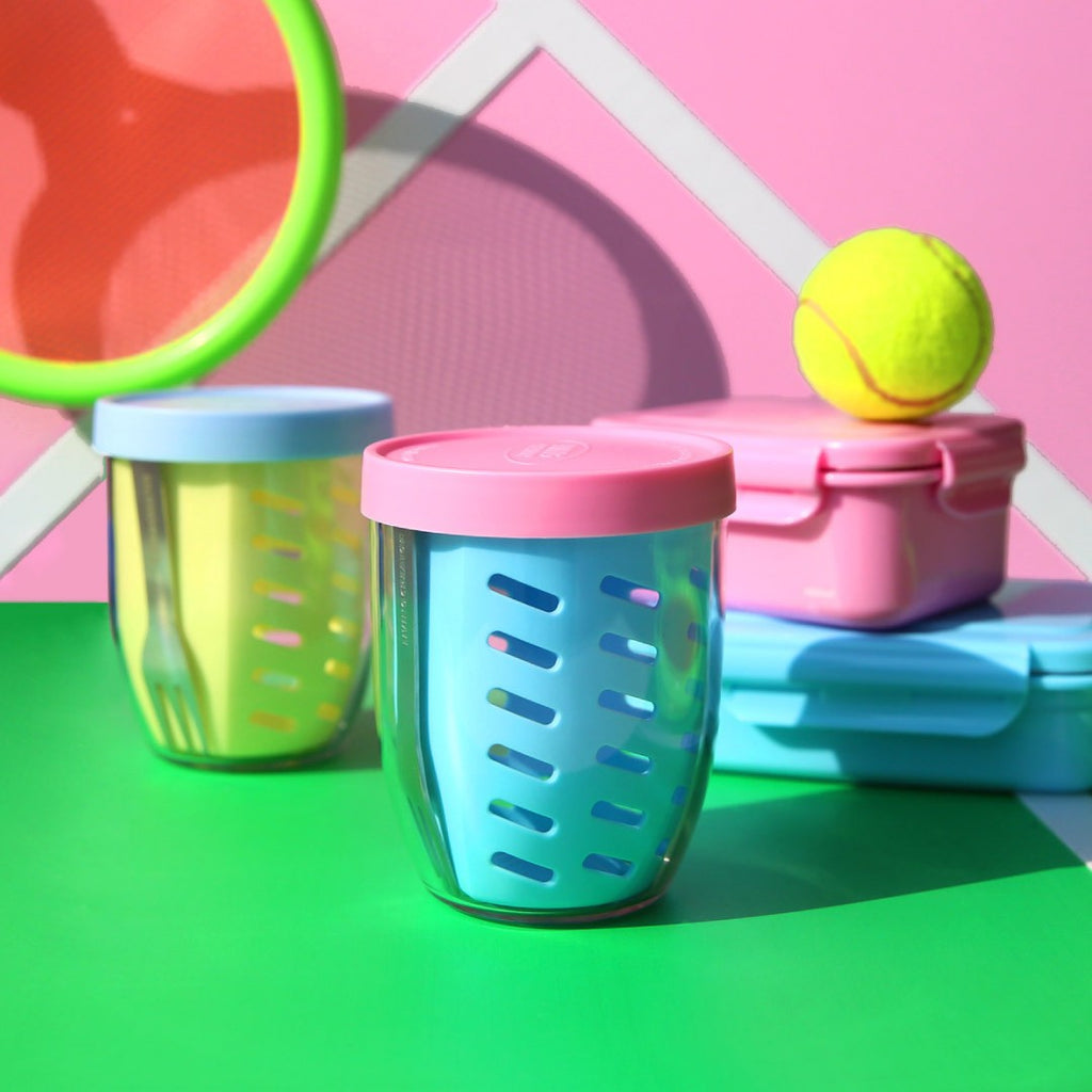 Three KEEPER POT color pairs on a tennis court set