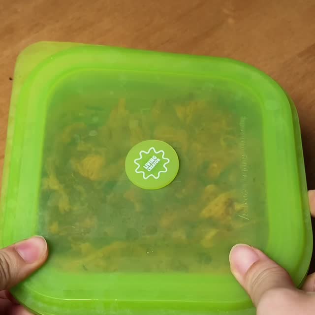 Hands pressing the lid onto a filled PushLock