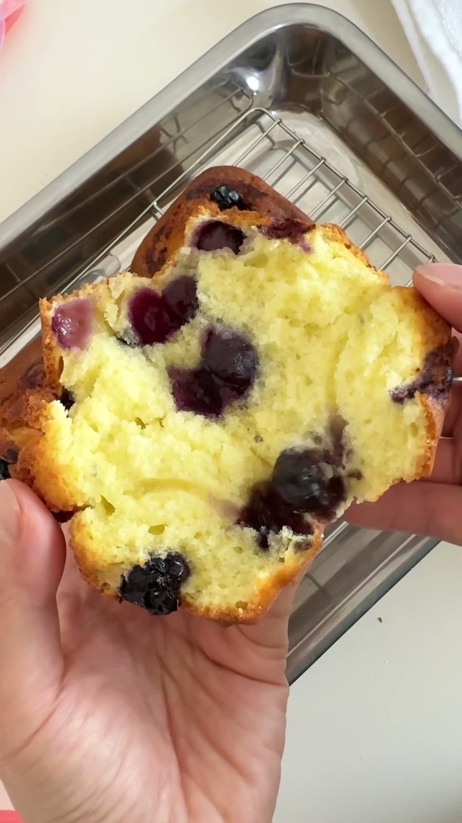 A blueberry muffin baked in a PushLock, torn open