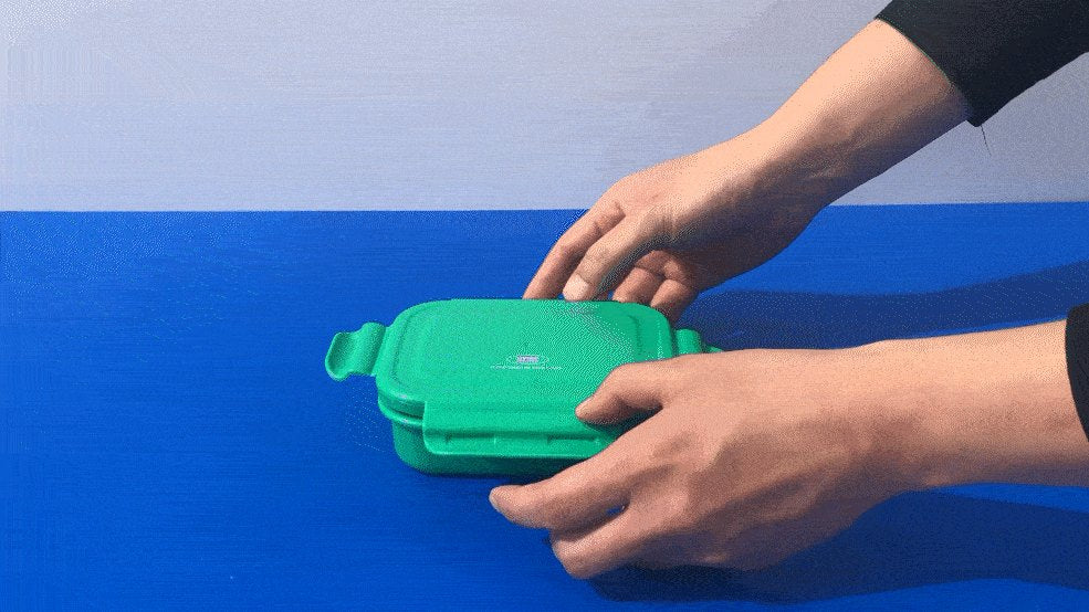 Hands locking all four sides of a KEEPER TEN lid