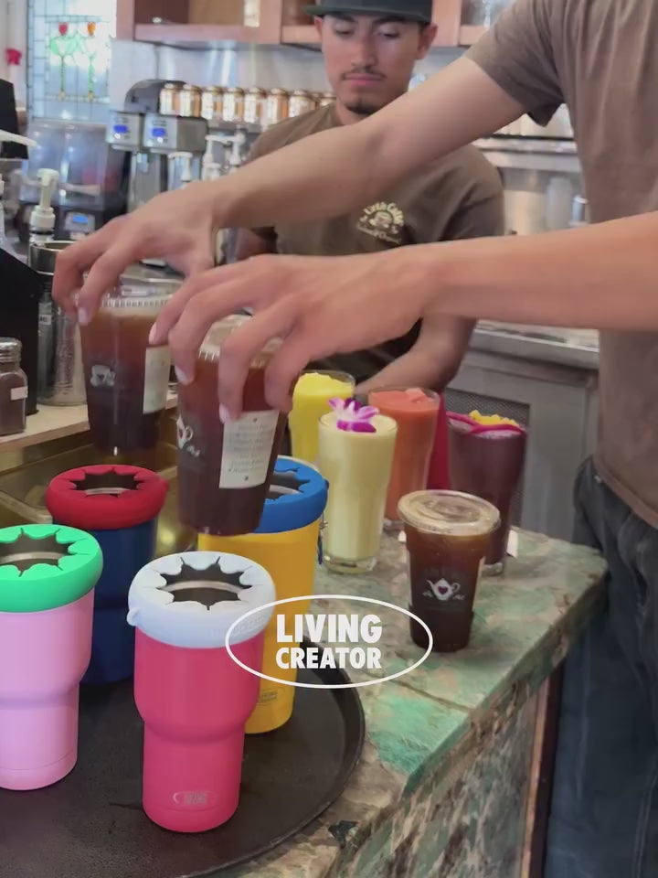 Cafe staff drops a take-out iced coffee straight into a KEEPER TUM holder